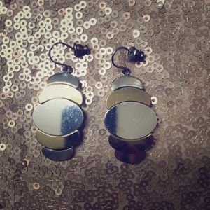 Gold and silver dangle earrings.